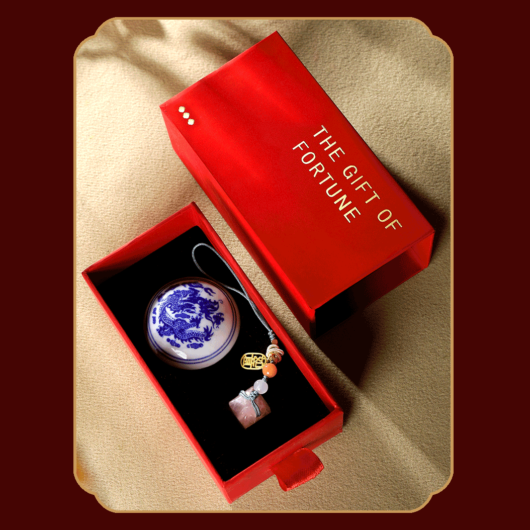 Sophisticated pink crystal seal ornament with decorative beads and a gold ruyi charm in red gift box