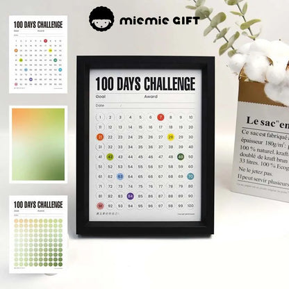A sleek black-framed 100 Days Challenge tracker featuring vibrant gradient paper options. Perfect for goal tracking and adding a touch of elegance to your home or office decor.