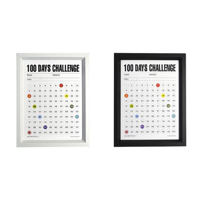 Two 100 Days Challenge Frames showcasing color-coded progress tracking, available in classic white and black frames. The minimalist design offers a stylish choice for home or office decor while keeping you motivated to achieve your goals.