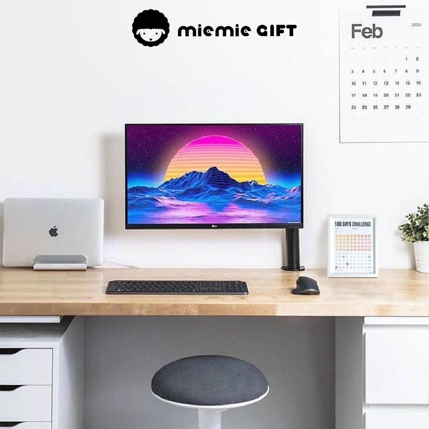 A modern workspace featuring a clean wooden desk, a vibrant computer screen, and a 100 Days Challenge Frame placed neatly beside a potted plant. The frame adds motivation and style to the setup, making it perfect for productivity and goal tracking.