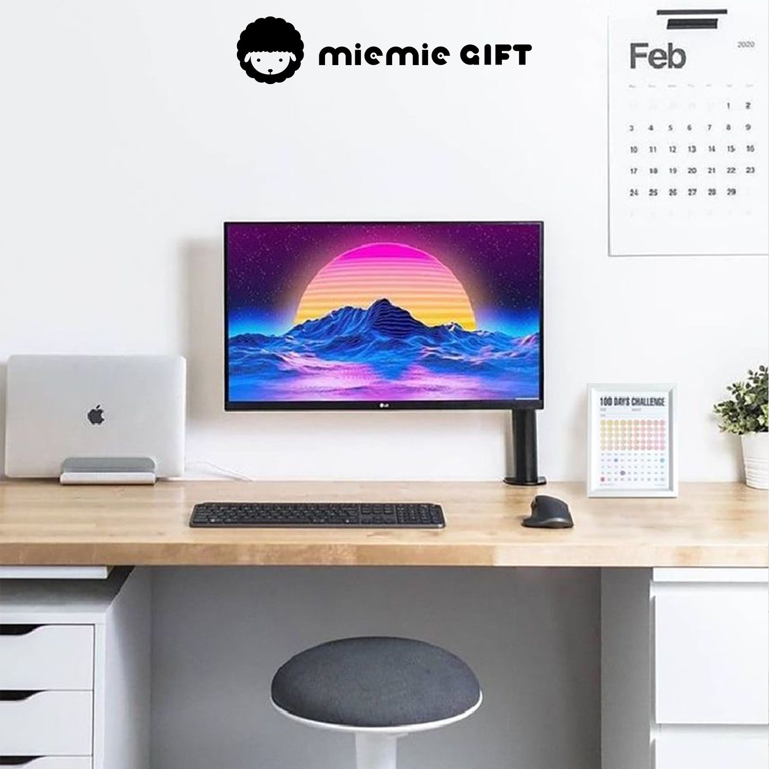 A modern workspace featuring a clean wooden desk, a vibrant computer screen, and a 100 Days Challenge Frame placed neatly beside a potted plant. The frame adds motivation and style to the setup, making it perfect for productivity and goal tracking.