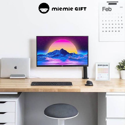 A modern workspace featuring a clean wooden desk, a vibrant computer screen, and a 100 Days Challenge Frame placed neatly beside a potted plant. The frame adds motivation and style to the setup, making it perfect for productivity and goal tracking.