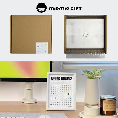 The 100 Days Challenge Frame in eco-friendly packaging with protective layers, ensuring safe delivery. The bottom image shows the frame elegantly displayed on a desk, accompanied by a vase, candle, and tape, highlighting its blend of functionality and aesthetics in a workspace setting.
