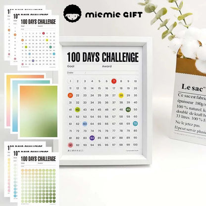 A white-framed 100 Days Challenge tracker with multiple vibrant gradient paper options, including warm, green, and blue tones. This image showcases the customizable design, perfect for goal setting and adding a stylish touch to any space.