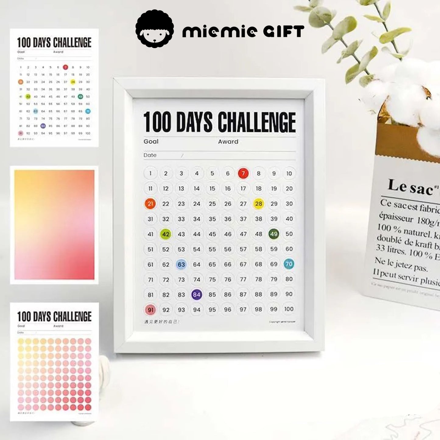 A white-framed 100 Days Challenge tracker featuring a Warm Sunshine gradient option for visualizing progress. Additional gradient designs and close-ups are shown, highlighting vibrant and customizable options. The frame is styled alongside a minimalist cotton branch vase for an elegant touch.