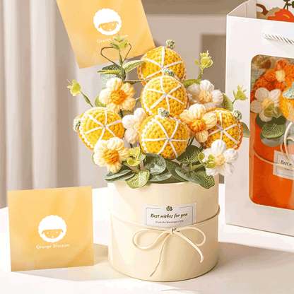 Crochet Art Flower Bouquet A bouquet of hand-knitted orange blossom a piece of crochet art carefully packed in a white bucket with gift card