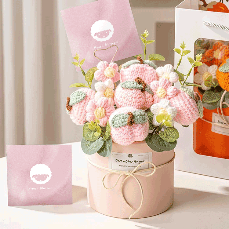 Hand-knitted flower Bouquet A delightful arrangement of crocheted peach blossoms presented in a pastel pink box with a Best wishes for you tag and a matching card