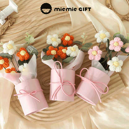 Handmade Daisy Color Palette A bouquet of hand-knitted daisies in a range of colors symbolizing diversity and beauty in pink boxes with ribbons