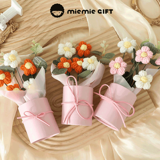 Handmade Daisy Color Palette A bouquet of hand-knitted daisies in a range of colors symbolizing diversity and beauty in pink boxes with ribbons