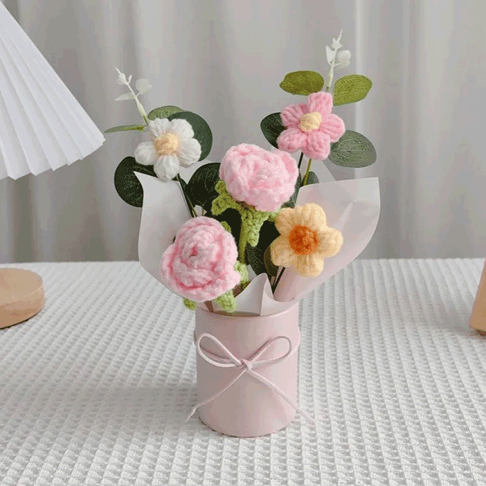 Vibrant pink rose crochet decor bucket with detailed daisies, leaves, and a satin-tied wrapping
