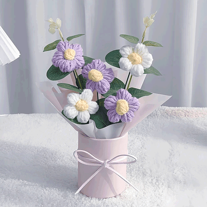 Crocheted purle Daisy Elegance A hand-knitted bouquet of daisies a testament to the beauty of handcraft tied with a pink ribbon