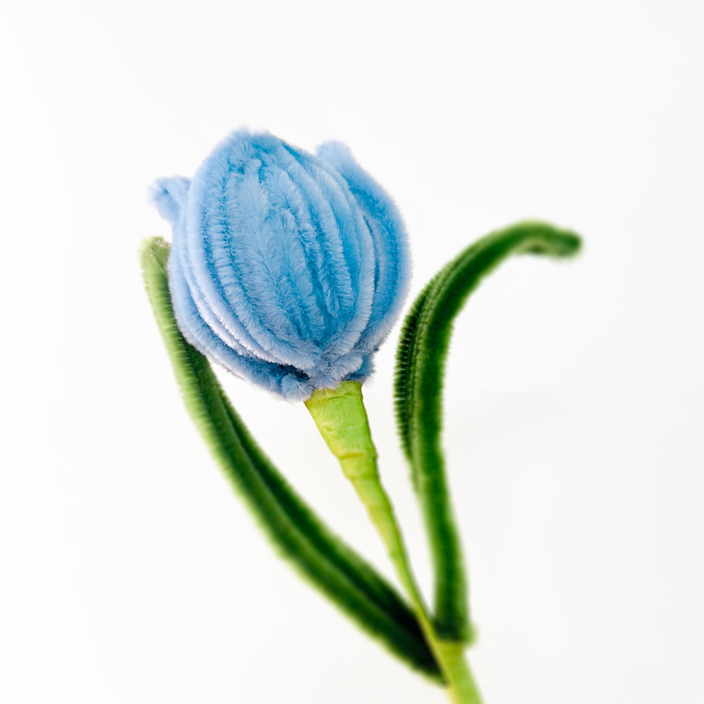 Handmade blue tulip with delicate petal details, crafted with premium pipe cleaners.