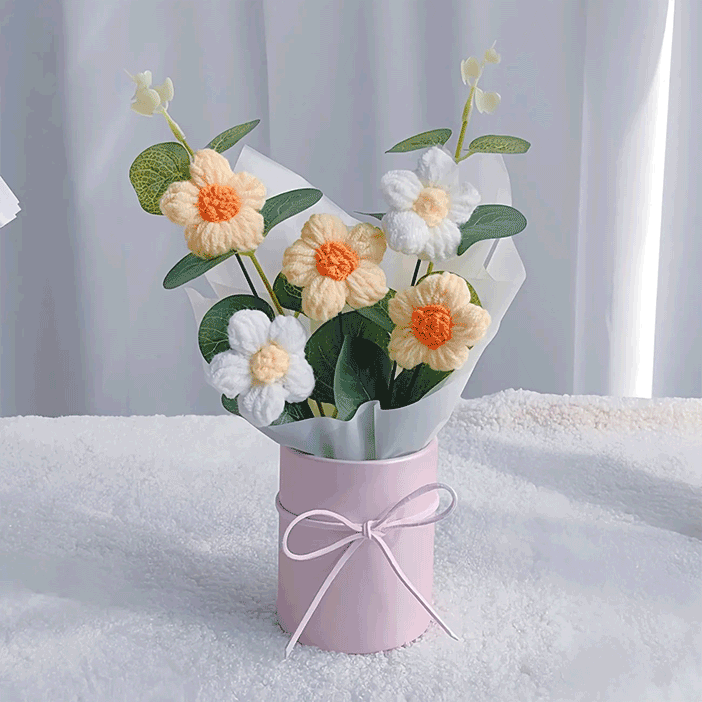 Crochet Daisy Beauty: A hand-knitted bouquet of daisies, a thoughtful gift for loved ones, showcased in a pink box with a bow