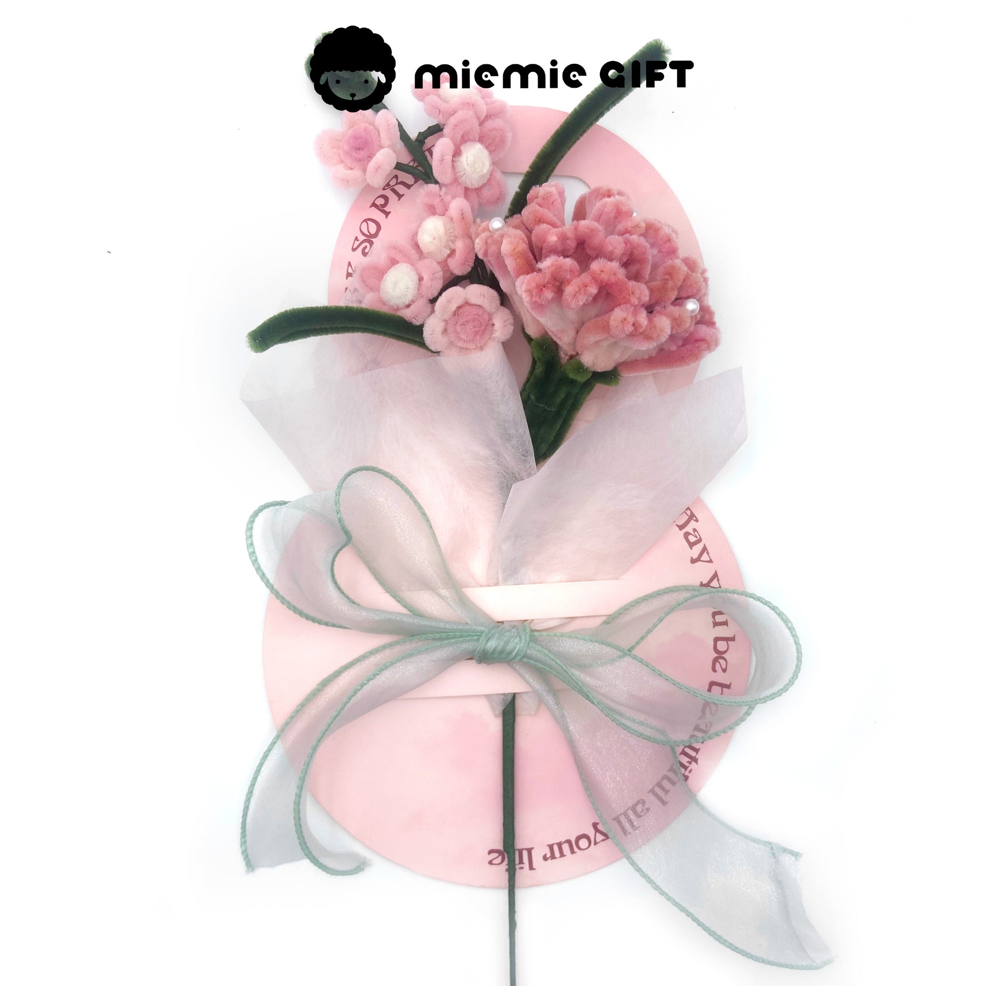 Blush pink pipe cleaner carnations wrapped in organza, gift-ready