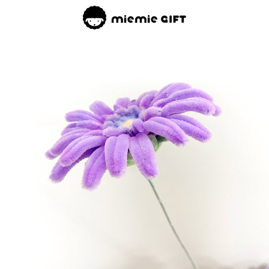  Side perspective of a handcrafted purple frangipani flower made from pipe cleaners, ideal for DIY projects and creative decor.