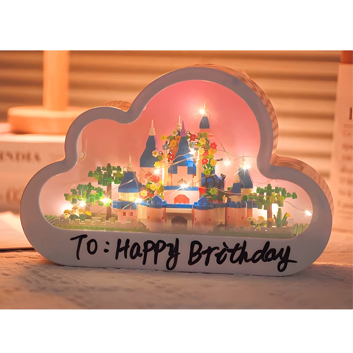 A glowing cloud-shaped DIY nightlight with a castle inside, featuring "Happy Birthday" written on the front, perfect for gifting.