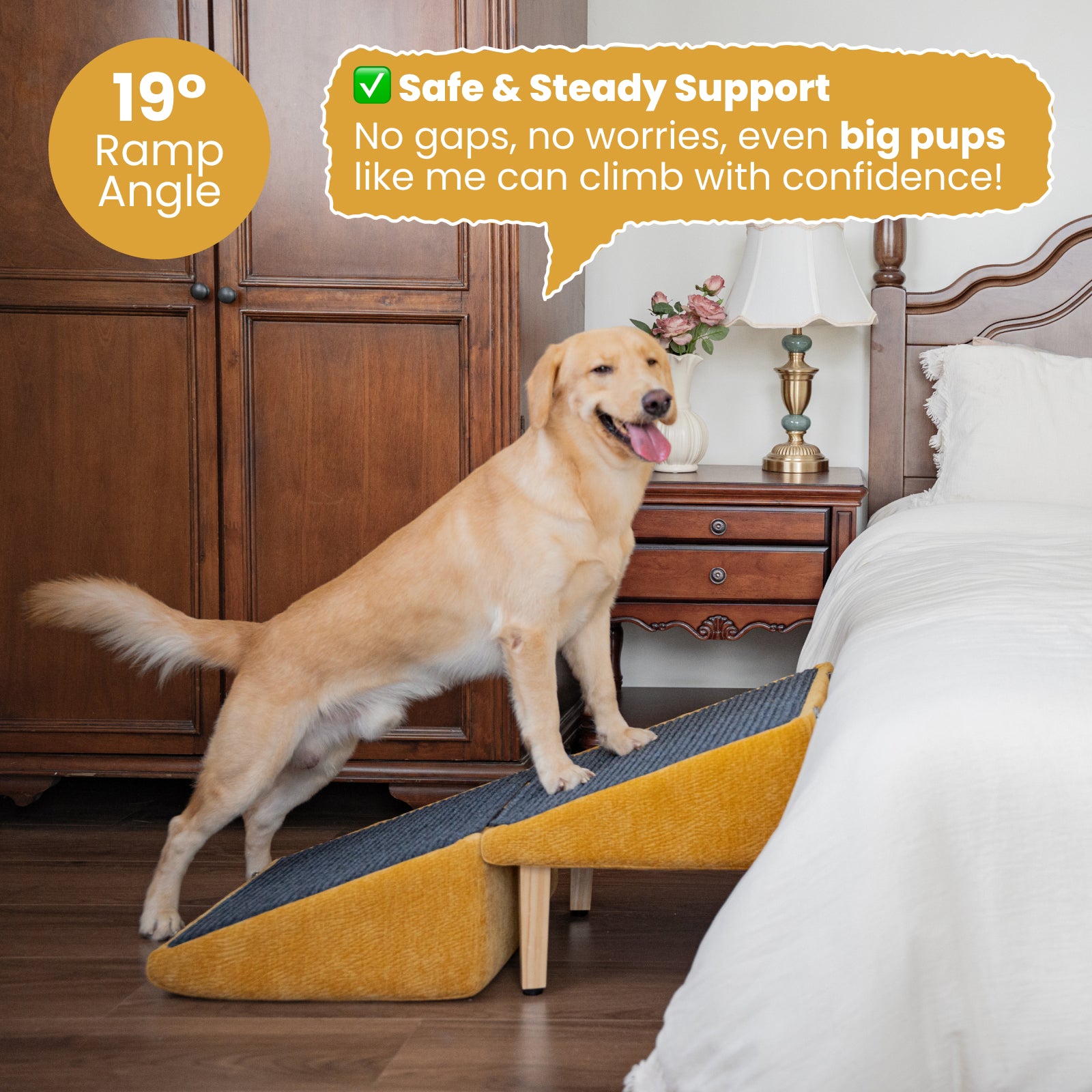 A happy golden retriever confidently standing on a mustard-yellow dog ramp leading to a white bed. The ramp features a 19-degree incline, anti-slip carpet surface, and sturdy wooden legs, designed for large dogs. The background includes a classic wooden nightstand, brass lamp, and floral accents, creating a cozy bedroom scene. A speech bubble highlights the ramp’s safety and stability for big pups.
