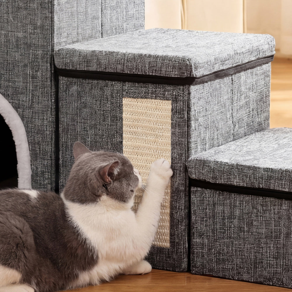 Cat using the built-in cat scratcher on foldable pet stairs for scratching, stretching, and play.