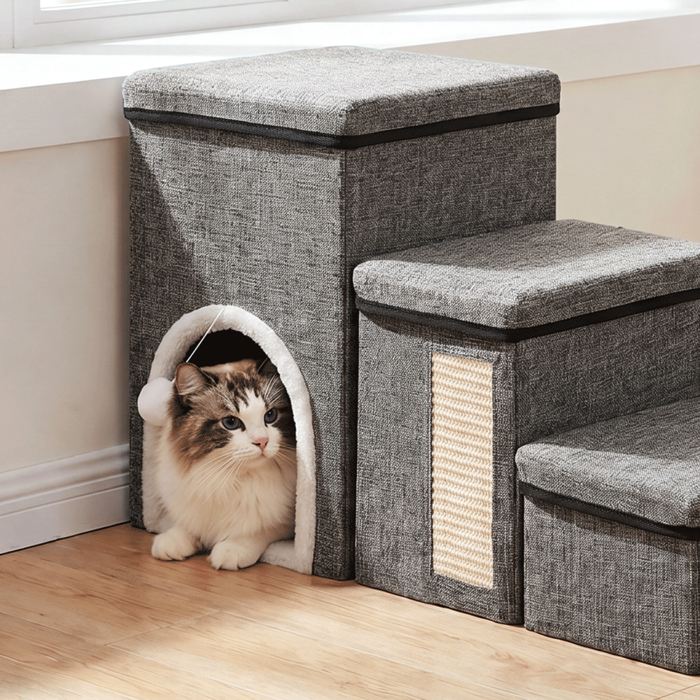 Cat resting inside the semi-enclosed hideaway of foldable pet stairs with storage and cat scratcher.