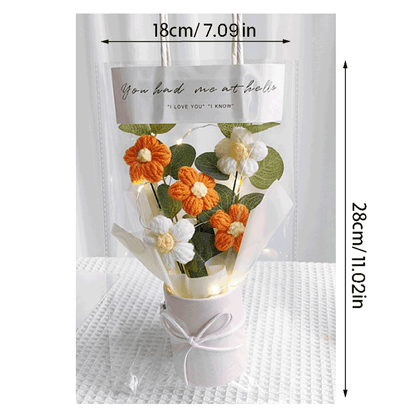 Knitted orange Daisy Serenity A bouquet of hand-knitted daisies a gift of peace and tranquility presented in a white bucket with a bow and clear gift bag