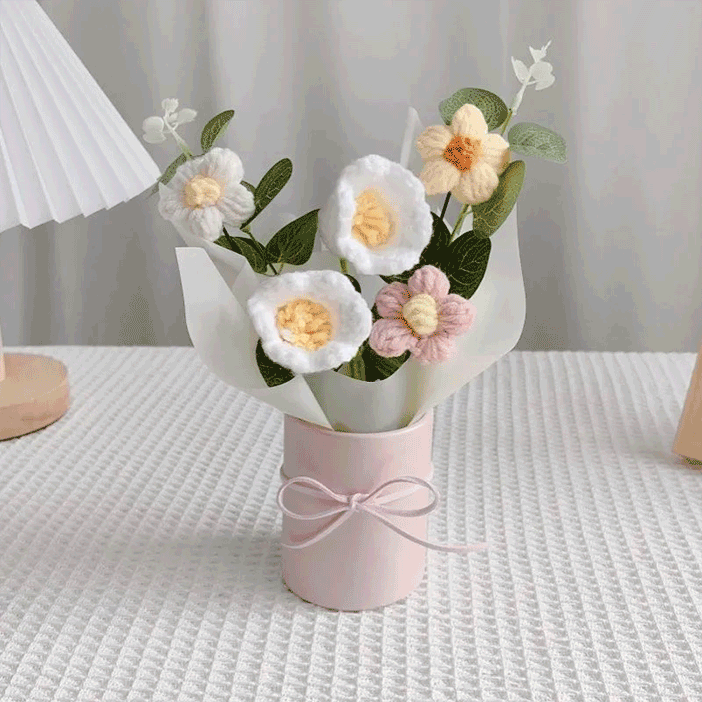 Hand-knitted lily of the valley Display A bouquet of flower hand-knitted to perfection in a pink pot with a white wrapping paper