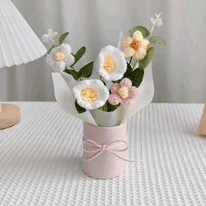 Hand-knitted lily of the valley Display A bouquet of flower hand-knitted to perfection in a pink pot with a white wrapping paper